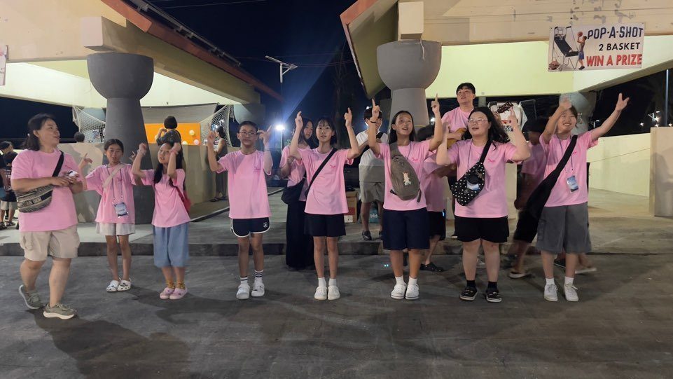 The Juan Presbyterian Church vision trip team singing and dancing at the Chamorro Village night market